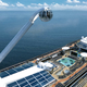 Illustration for article titled Royal Caribbeans New Ship Hangs You 300 Feet Above the Deck In a Crane